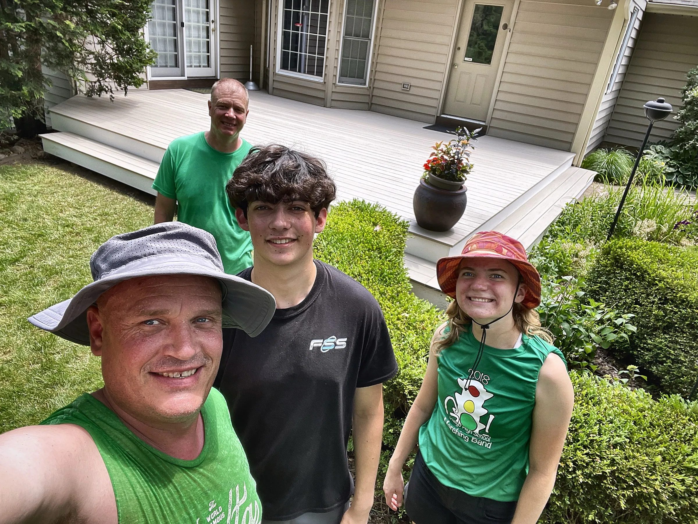 The crew taking a selfie in front of a finished composite deck